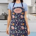 Delantal Nombra de patrón floral de color pastel botánico<br><div class="desc">Bonito primavera rosa floral,  naranja y verde sabio adornado delantal marino femenino con nombre personalizado o texto sobre una forma geométrica ovalada de color rosa rubor.</div>