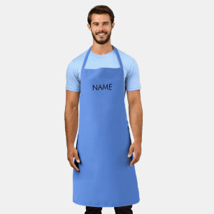 Delantal nombre del personalizar, texto azul de flor de maí