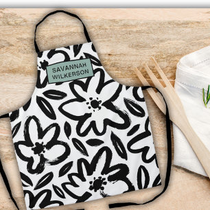 Delantal Nombre moderno de flor blanca y negra