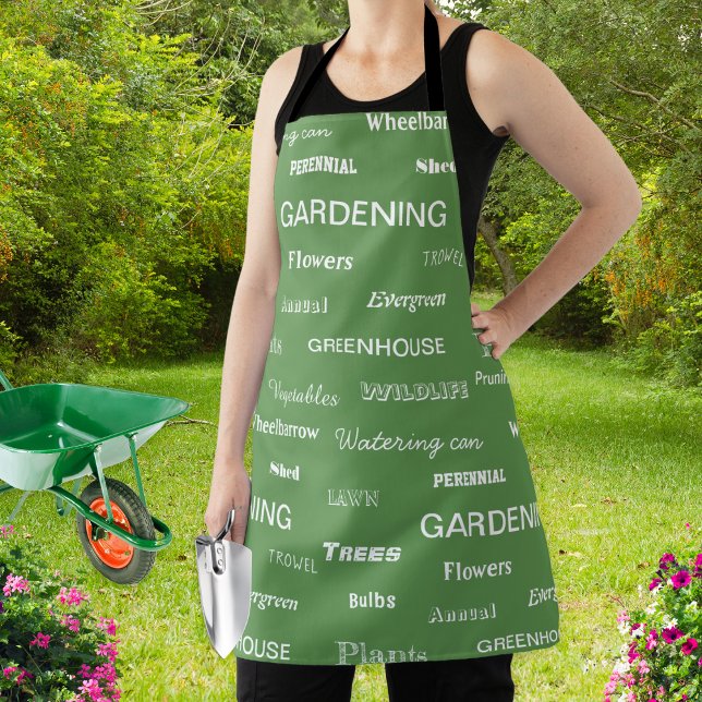 Delantal Palabras de jardinería estampadas en el elegante j (A stylish apron for garden lovers, patterned with gardening related words on a green background)