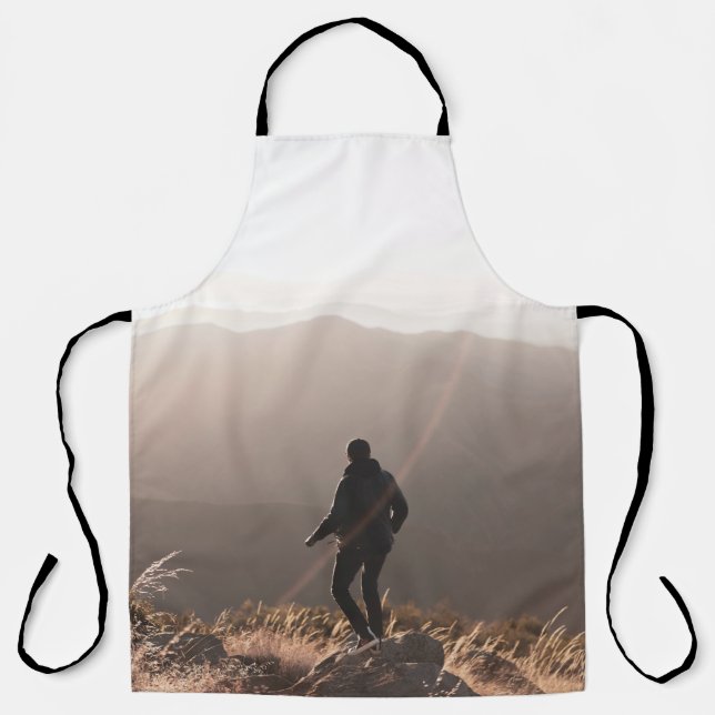 Delantal Persona de pie sobre una roca (Anverso)