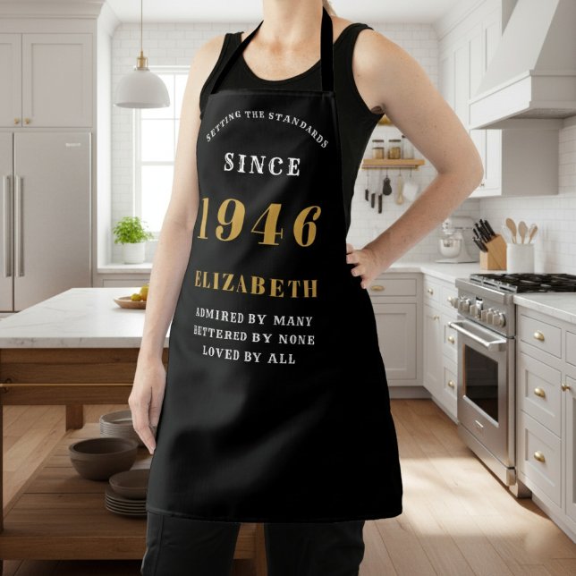 Delantal Personalized 80th Birthday 1946 Black & Gold (1946 birthday apron in black and gold worn in a kitchen.)