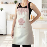 Delantal Purpurina de pastelitos rosados Dris Pastelería de<br><div class="desc">Aquí hay una manera maravillosa de añadir a la diversión del hornear. Añada un poco más de brillo a sus aventuras culinarias cuando use este elegante, sofisticado, sencillo y moderno delantal. Un aguacate dorado brillante, rosa, goteo de purpurinas y tipografía escrita a mano en gris oscuro superponen un oscuro fondo...</div>