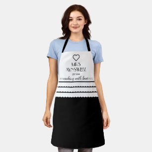 Delantal Sra. personalizada Cocinar con amor negro
