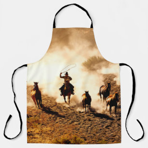 Delantal Vaqueros persiguiendo caballos marchitos. rodadura