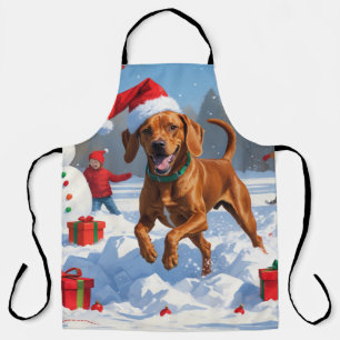 Delantal Vizsla corriendo en la nieve con sombrero de Navid