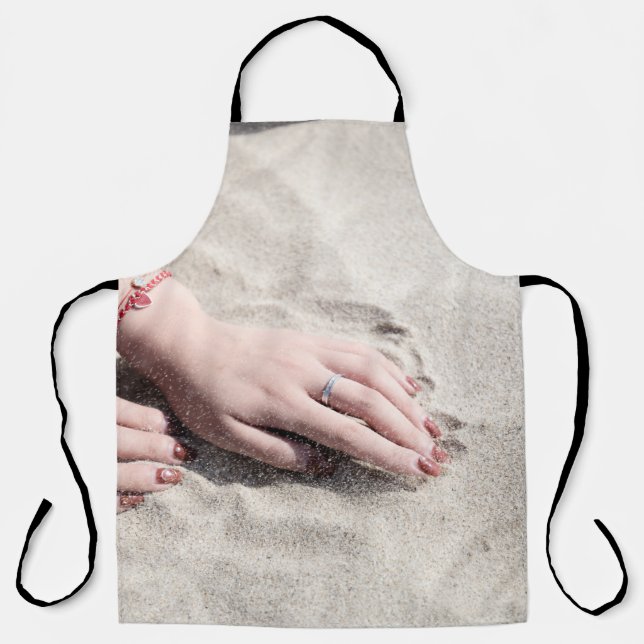 Delantal Woman lying on white sand (Anverso)