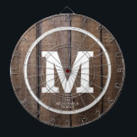 Diana Monograma personalizado de la familia Rustic Barn<br><div class="desc">Juegue un divertido juego de dardos con este Rustic Barn Wood Family Personalized Monogram Dart Board. Está diseñado con un fondo marrón de madera falsa y su gran monograma blanco de negrita inicial en el centro. También el dart board es personalizado con el apellido de la familia debajo de la...</div>