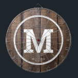 Diana Monograma personalizado de la familia Rustic Barn<br><div class="desc">Juegue un divertido juego de dardos con este Rustic Barn Wood Family Personalized Monogram Dart Board. Está diseñado con un fondo marrón de madera falsa y su gran monograma blanco de negrita inicial en el centro. También el dart board es personalizado con el apellido de la familia debajo de la...</div>