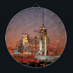 Diana Red Sky para el lanzamiento del transbordador espa<br><div class="desc">El fresco aire matutino fue eléctrico con anticipación mientras los primeros rayos del amanecer pintaban el cielo de rojo intenso. La colosal silueta blanca del transbordador espacial Atlantis dominó el Launchpad, eclipsado sólo por la inmensidad del momento. Una bocanada colectiva chocó contra la multitud cuando se desataron ciruelas de fuego...</div>