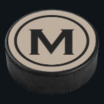 Disco De Hockey Monograma negro simple inicial<br><div class="desc">El diseño mínimo monogramado presenta un medallón monograma negro y beige en una tipografía blanca clásica de bloques. Personaliza con tu inicial.</div>