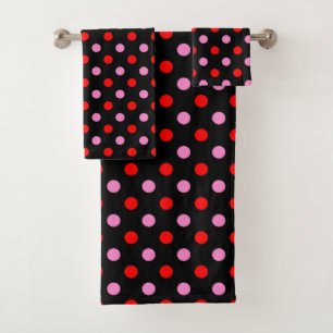 Diseño de lunares rojos y rosados sobre negro