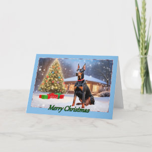 Doberman con tarjeta de Navidades de árbol