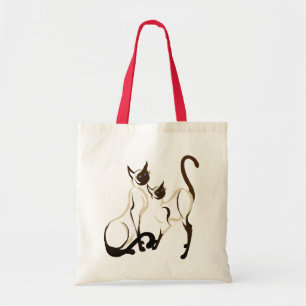Dos bolsos de los gatos siameses