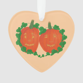 Dos calabazas en adornos de viñas de corazón de am