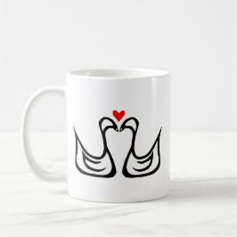 Dos cisnes y una taza del corazón