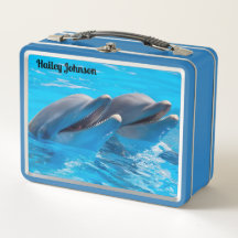 Dos delfines en agua azul