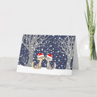 Dos lobos en tarjeta de felicitación del navidad