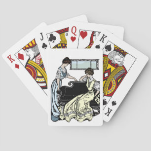 Dos mujeres con largas vestimentas jugando cartas