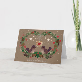 Dos pájaros en una guirnalda del navidad