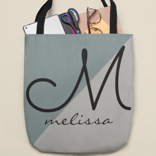 Dos tonos de una bolsa de tote gris grande con el