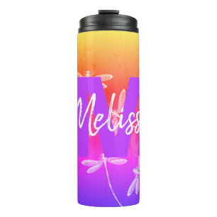 Dragonflies en el vaso termal de agua