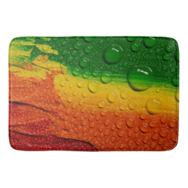 Droplets de agua sobre coloridas alfombras de baño