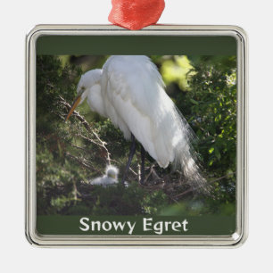 Egret de nieve con ornamento de bebé