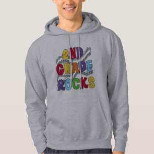 El 2do grado multicolor oscila las camisetas y los