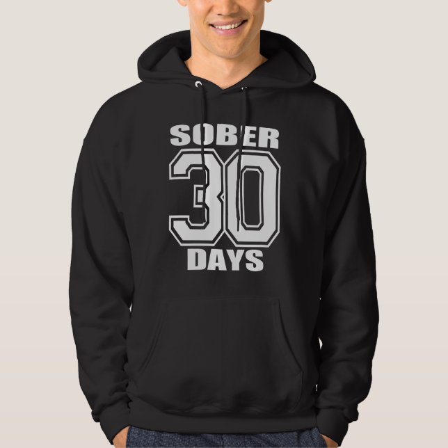 EL BLANCO EN SUDADERA CON CAPUCHA NEGRA CALMA 30 (Anverso)