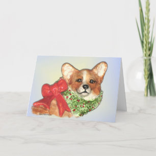El Corgi con enrruella la tarjeta de Navidad