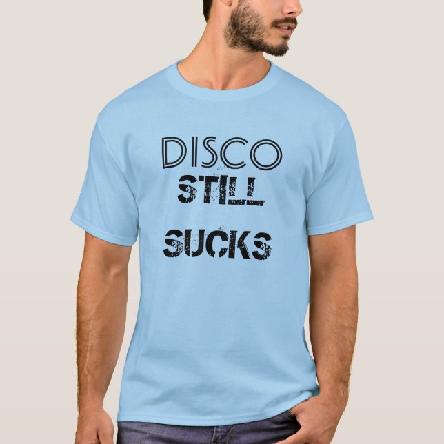 El "disco todavía chupa" la camiseta (Anverso)