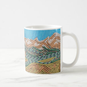 El indio enarbola la taza de café
