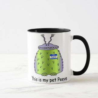 El mascota Peeve la taza