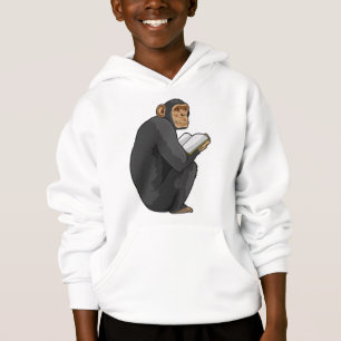 El mono como nerd con el libro