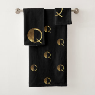 El negro y el oro del monograma Q miran tipografí