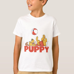 El perrito juega las camisetas y los regalos