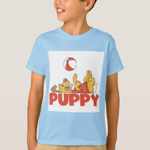 El perrito juega las camisetas y los regalos