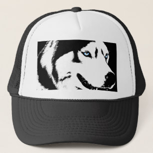 El perro esquimal capsula el regalo de los gorras
