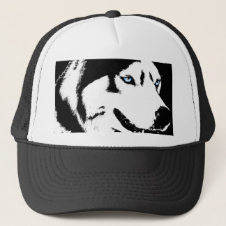 El perro esquimal capsula el regalo de los gorras