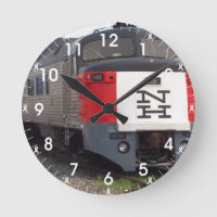 El reloj de pared determinado del tren de Rogelio