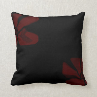 El rojo florece la almohada de tiro