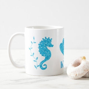 El seahorse y el seashell azules añaden la taza