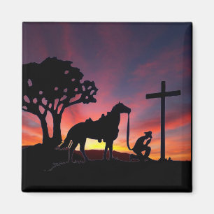 El vaquero de rogación en el pie del imán cruzad