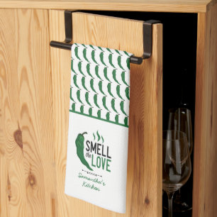 El verde Chile huele la toalla de la cocina del am