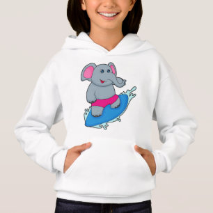 Elefante como surfista con tabla de surf