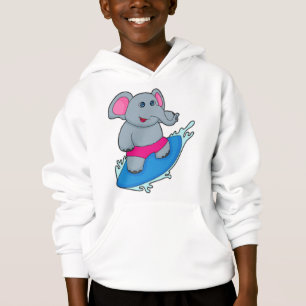 Elefante como surfista con tabla de surf
