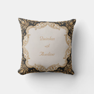 Elegante almohada negra y barroca dorada