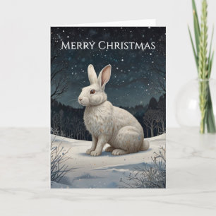Elegante conejo blanco de Navidad en un bosque nev