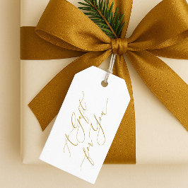 Elegante etiqueta de Navidad con letra dorada “Un